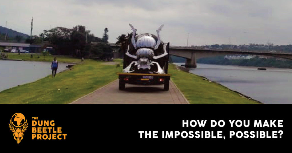 Dung Beetle stage being carried on a trailer.